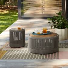 A coffee table is a low table designed to be placed in a sitting area for convenient support of beverages, remote controls, magazines, books (especially large, illustrated coffee table books), decorative objects, and other small items. Porto Outdoor Round Coffee Table