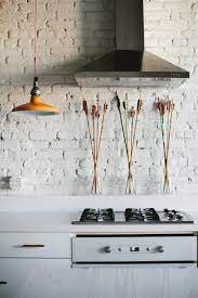 A light and natural colored brick style kitchen backsplash deliver a rustic feel to this kitchen. Brick Backsplashes Rustic And Full Of Charm