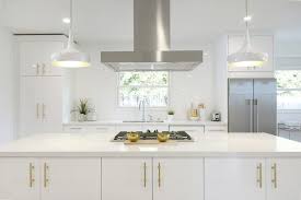 White And Gold Kitchen With Long Brushed Brass Pulls Contemporary Kitchen Gold Kitchen Kitchen Handles Gold Kitchen Hardware