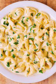 Tortellini means 'little twists' in italian and is rumored to have been shaped after venus's navel. Creamy Asiago Cheese Tortellini Julia S Album