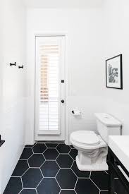 Often times, the field of white hex tiles would be left bare with merely a mosaic border pattern in black or some other accent color to give a pop to the otherwise antiseptically white. Modern Hexagon Tile Floor Decor The Tomkat Studio Blog