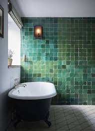 The storage cabinet is also in black to complete the look. 25 Dreamy Green Bathrooms That Inspire Shelterness