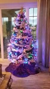 Silver Decorations With Multi Colored Lights Silver Decor Holiday Decor Decor