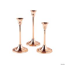 Candles for centerpieces at a wedding add elegance and shine to the special day. Copper Taper Candle Holder Set