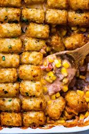 This easy taco casserole with ground beef, tater tots, refried beans, and lots of cheese will be your new favorite weeknight dinner! Cowboy Casserole Recipe Aka Tater Tot Casserole The Recipe Critic