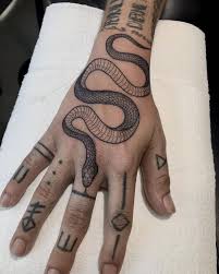Snake Tattoo By Charlie Rose Tattoo Canggu Bali Sticknpokes Hand Tattoos Snake Tattoo Design Traditional Snake Tattoo