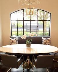oval dining table with gray bench and