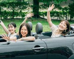 family enjoying Okinawa scenery with a rental carの画像