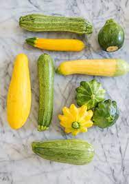 The trailing nature of zucchini vines causes the vegetables to take over a large area of the garden. A Visual Guide To 8 Varieties Of Summer Squash Kitchn