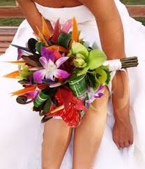 Greenery and flower tropical centerpieces. Renee Thomas Designs Wedding Bouquets Tropical Wedding Bouquets Flower Centerpieces Wedding Wedding Flower Arrangements