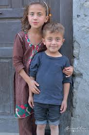 Jeune Fille Et Jeune Garcon Wakhi Devant La Porte De Leur Maison C Bernard Grua Pakistan Lahore