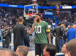 Dallas Mavs' forward Anthony Davis is wearing a Jordan Love Green Bay Packers jersey at tonight's Mavericks game. Davis — a big Packers fan — will be out another 7-10 days before