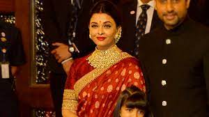 Aishwarya Rai Bachchan S Red Benarasi Sari Is A Wedding Trousseau Must Have Vogue India Aishwarya rai donned a black and cream combination mirror embellished kurta and lehenga by manish malhotra. aishwarya rai bachchan s red benarasi