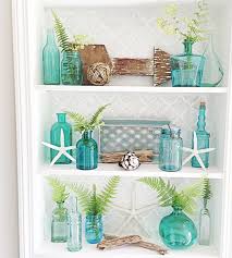 Since beach house style is essentially carefree and relaxed, it's easy to go overboard with coastal decorating. Coastal Style Home Coastal Blue Aqua Coastal Interiors Sea Shells Coastal Curtains Inspiration Coastal Liv Beach House Decor Coastal Shelf Decor Bathroom Decor