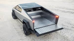 Both the glass shatter in the same way. Tesla S Bulletproof Cybertruck Comes With Pop Up Camper Configuration