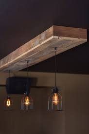 These Hanging Light Fixtures Are Best Classified As Mood Lighting They Are Not Powerful Enough Or B Barn Wood Decor Rustic Kitchen Lighting Wood Light Fixture