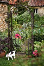 Scroll garden arch in black between the spacious terrace and the lawn there is a wide, not yet planted strip of beds, which is waiting to be made colorful. Uk Garden Supplies Extra Heavy Duty Garden Arch With Gate Mackintosh