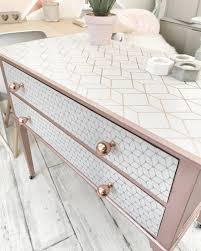 Chest Of Drawers Painted In Rose Gold Paint Decoupaged With Geometric Wallpaper Gold Painted Furniture Rose Gold Furniture Furniture Makeover