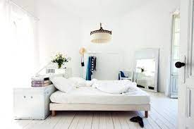 Either move the bed a few inches away from the wall (which might or might not work, depending on how much the frame will shift during sex) or put thick socks over the tops of the posts. Why You Should Consider Floating Your Bed Apartment Therapy