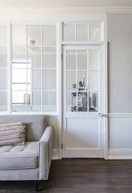 An Interior Wall Of Windows Brings Light To This Guest Alcove Interior Windows Living Room Design Diy Room Partition Wall