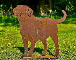 Sitting regally, the statue loyally greets you and your family and friends. Digging Dog Etsy