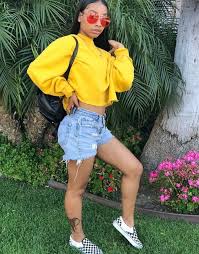 Baddie Black And White Vans Outfit Instagram Baddie Wearing Distressed Jean Shorts Black And White Checkered Vans Sneakers And A Yellow Sweatshirt Crop Top Red Sh Fashion Outfits Cute Outfits