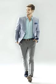 A Suit Without The Tie Helps Create A More Casual Appearance Appropriate For Day Mens Fashion Business Casual Mens Fashion Suits Casual Business Attire For Men
