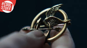 Check spelling or type a new query. Cool Stuff The Mockingjay Pin The Hotcorn