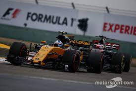Jolyon Palmer Renault Sport F1 Team Rs17 Leads Romain Grosjean Haas F1 Team Vf 17 Haas F1 Team Sport F1 Jolyon Palmer