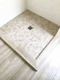 Shower Curb Done In Tile To Match The Floor Expands The Look Of This Small Bathroom A Frameless Glass Enclosur Small Bathroom Big Bathroom Designs Shower Curb