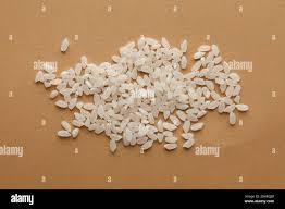 White Handful Rice On A Brown Background For Vegetarians Grocers Health Food Stores Rice Packaging Mockup Stock Photo Alamy
