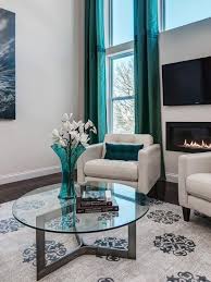 Mid Century Modern Living Room With Blue Wall Art And White Furniture Designers Portfoli Living Room Turquoise Teal Living Rooms Turquoise Living Room Decor