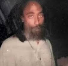 Either Tupac is still alive in 2022 or this is amazing photoshop work 😳