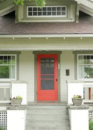 Chic cottage home features taupe siding framing a turquoise front door flanked by sidelights. The Best Paint Colors For Your Front Door
