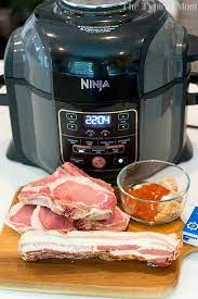 Ninja Foodi Air Fryer Pork Chop Recipe Ideas Here One Wrapped In Bacon With No Breading A Bacon Wrapped Pork Chops Air Fryer Recipes Salmon Bacon Wrapped Pork