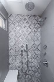 A primary bathroom featuring blue walls and a shed ceiling with a skylight, just above the freestanding tub. I Like This Tile As A Focal Point Everything Else Around It Is Plain And It S Not Terribly Master Bath Shower Tile Bathroom Remodel Master Tile Shower Niche