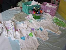 Make Your Own Onesie Station I Stole This Idea From A Friend S Baby Shower Get Plain Onesies Double Baby Showers Unique Onesies Retirement Party Decorations