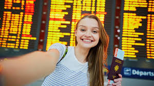 Busy airport departure hall with travellers checking in