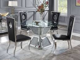 Mark dining table dimensions with tape on the floor to visualize how much space you'll have left on each side to pull chairs in and out. Silvertone Round Mirrored Dining Table