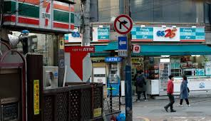 Woman at gs25 convenience store in seoul. Convenience Store Chains Sign Branch Truce