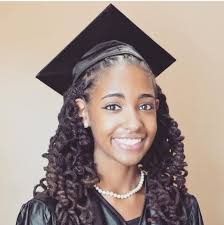 The big braided bun hairstyle. Top Ways To Slay In Your Graduation Cap With Natural Hair Essence