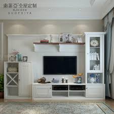 The designer open shelves on the top can be used for displaying memorable and showpieces. Wooden Showcase Designs For Living Room