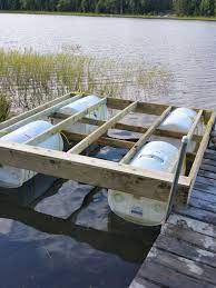 We used plastic 55 gallon barrels (drums) to float it and decked it with trex composite decking. Floating Dock With Barrels Updated Floating Dock Floating Dock Plans Floating Boat