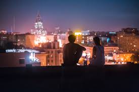 While desks and filing cabinets and computers meteor down on the crowd around the building and smoke funnels up from the broken windows and three blocks down the street the demolition team watches the clock, i know all of this. 5281320 3000x2000 Romance Roof Top City At Night People Silhouette Free Stock Photos Urban Roof Top View Roof Life City Building Sitting On Ledge City Light Perople Couple Rooftop Love Night