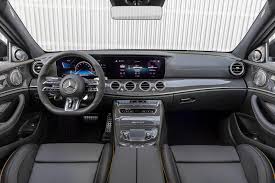 In the interior, the new amg performance steering wheel and the mbux infotainment system emphasize the vehicle's amg family. 2021 Mercedes Amg E63 Sedan Interior Photos Carbuzz