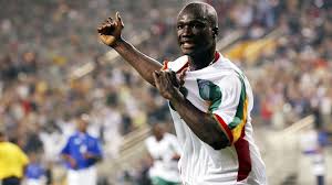 Premier buteur de la coupe du monde 2002, il avait inscrit l'unique but du match d'ouverture qui opposait le 31 mai 2002, dans la poule a, le sénégal à la france, alors championne du monde en titre. Qnoamcnu7ggelm