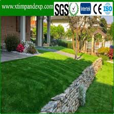 He is raking the soil to try and create a smooth surface but hasn't mentioned using type 1 or granite dust. China Easy Install Easy Maintainance Synthetic Landscape Grass Without Soil China Artificial Grass Artificial Turf