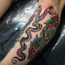 The red and black body of this viscous looking snake makes you know right away that this. Aztec 2 Headed Snake Tattoo