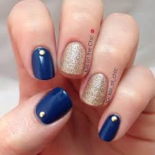 The nail art incorporates the matte color and glossy color all along with the bow pattern white addition. Navy Blue And Gold Nail Designs Novocom Top