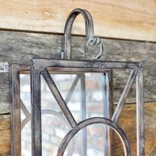A variety of sizes blend elegantly with whatever furnishings they are accenting. Iron Wall Mounted Candle Holder Black Country Metalworks